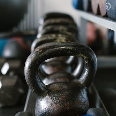 Close-up on a piece of simple gym equipment like a kettlebell.